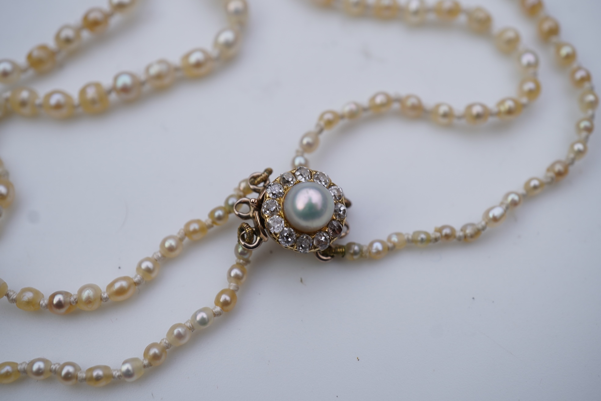 A natural pearl and diamond necklace, early 20th century